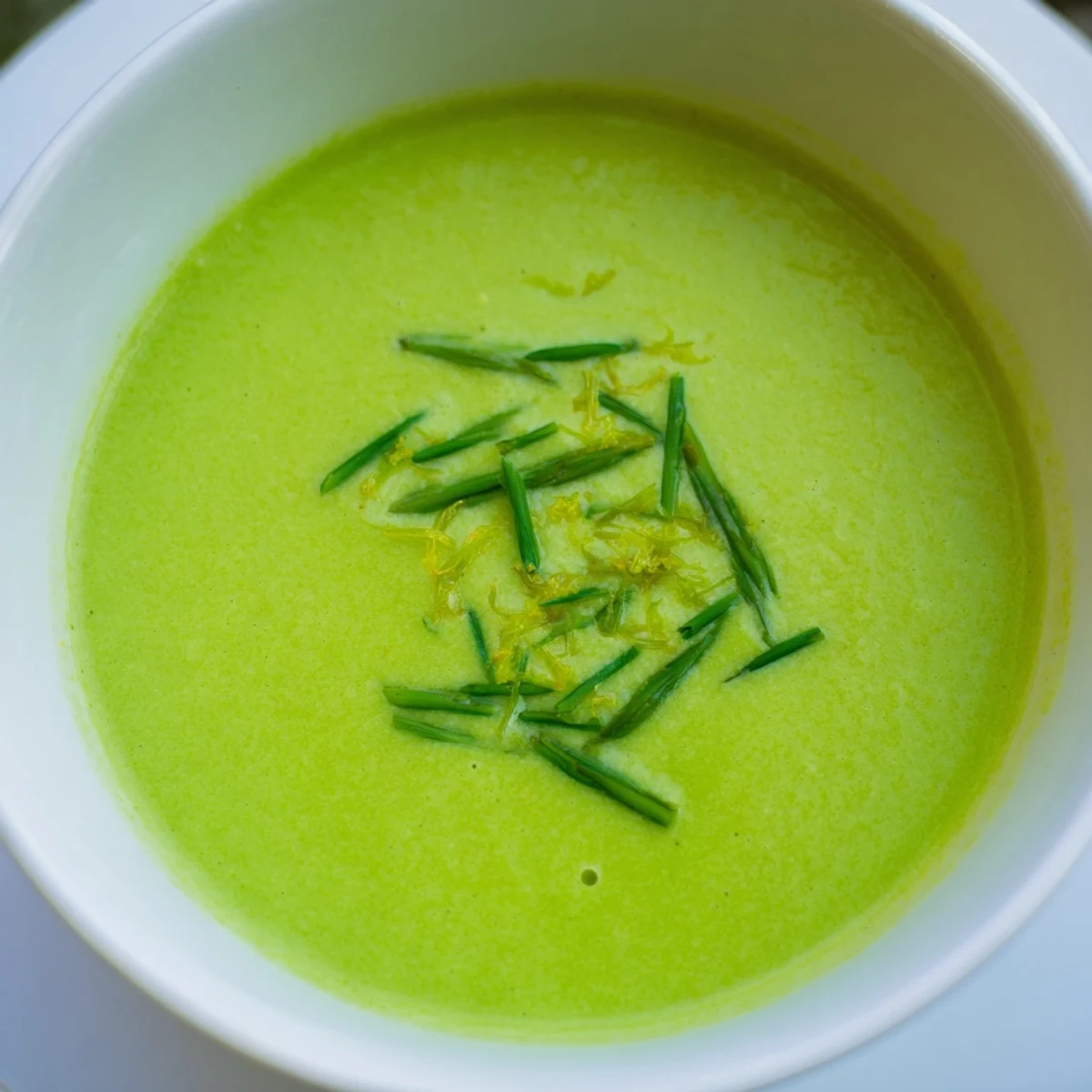 Close-up of Creamy Asparagus Soup with Lemon, showing its velvety texture and bright green color.
