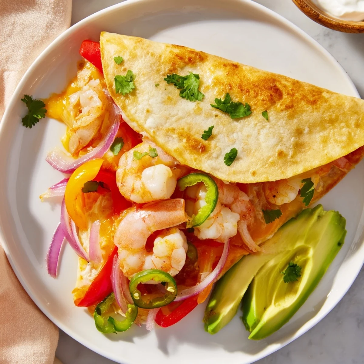 Golden-brown Shrimp Fajita Sheet Pan Quesadillas filled with sizzling shrimp and colorful peppers on a rustic wooden board.