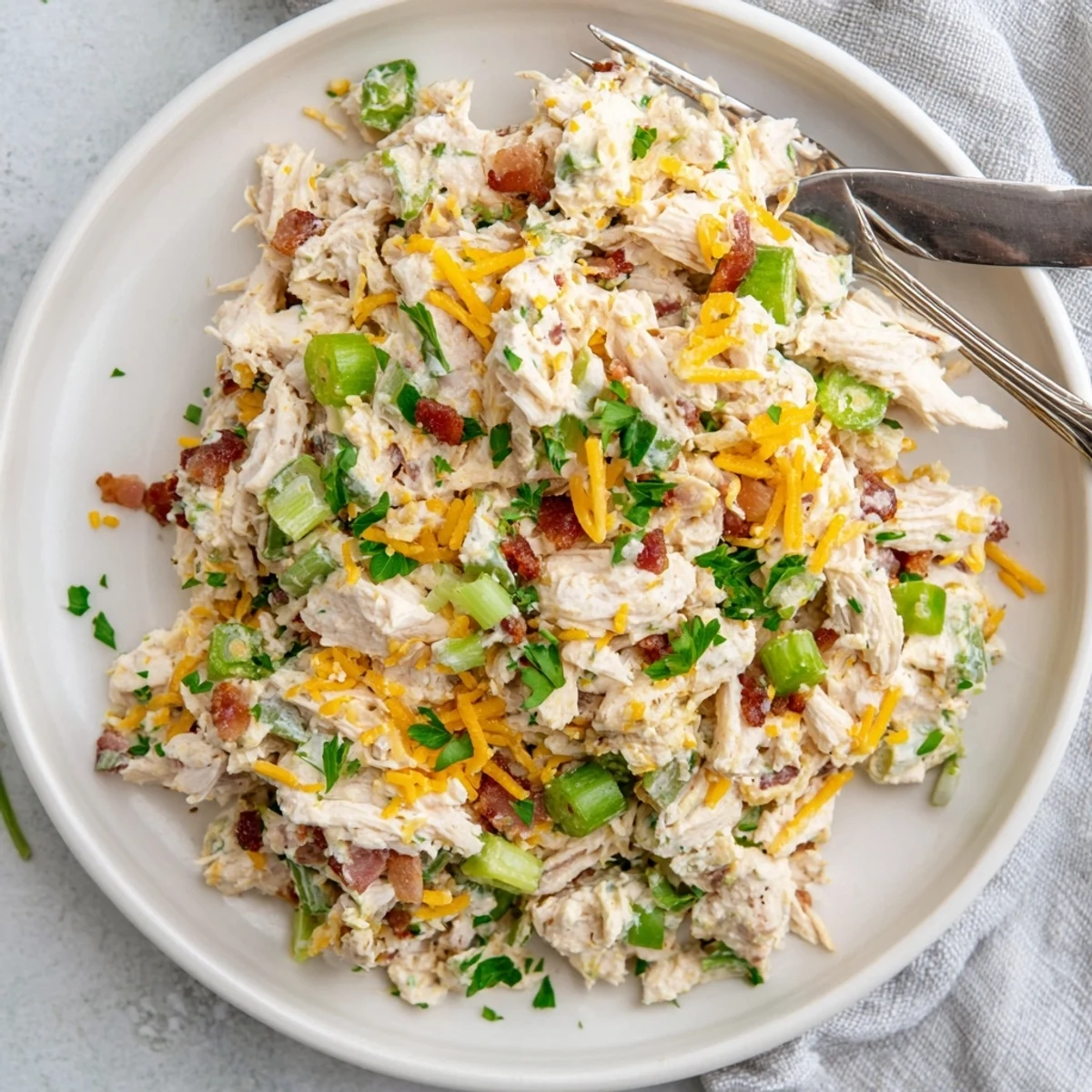 Creamy low carb jalapeno popper cottage cheese chicken salad topped with crispy bacon and fresh jalapeno slices