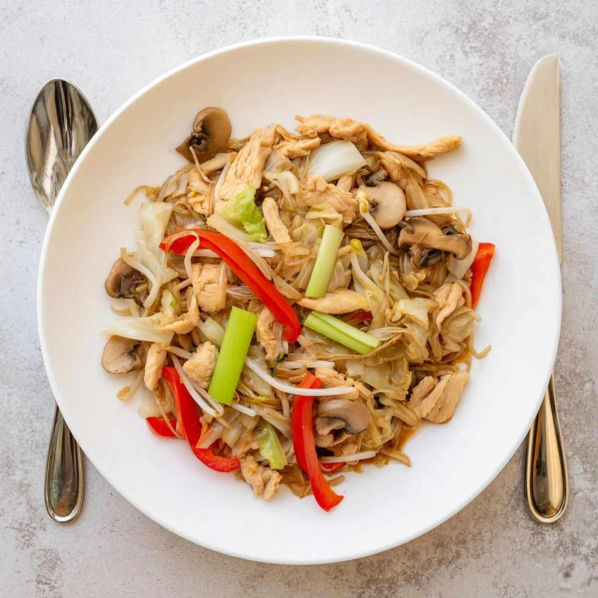 Hearty Chop Suey dish loaded with bean sprouts cabbage and meat served hot