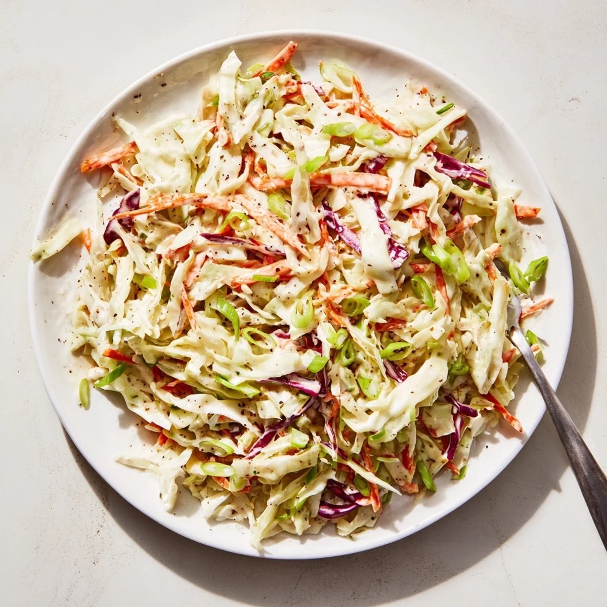 Bowl of refreshing easy creamy coleslaw perfect for summer barbecue picnics