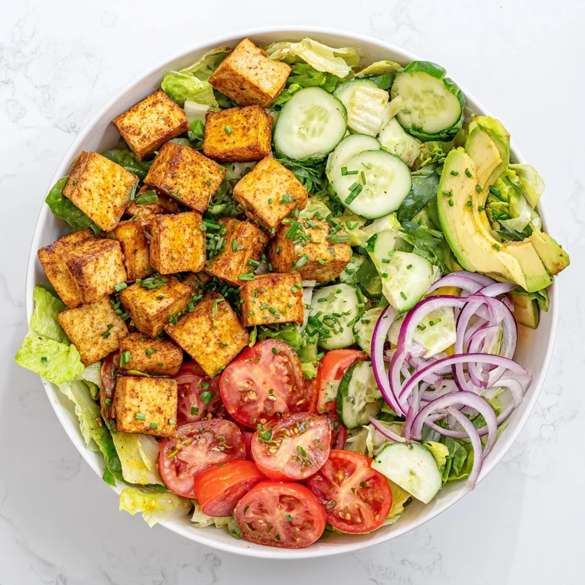 Vegan smoky tofu salad with crisp vegetables and lemon maple dressing