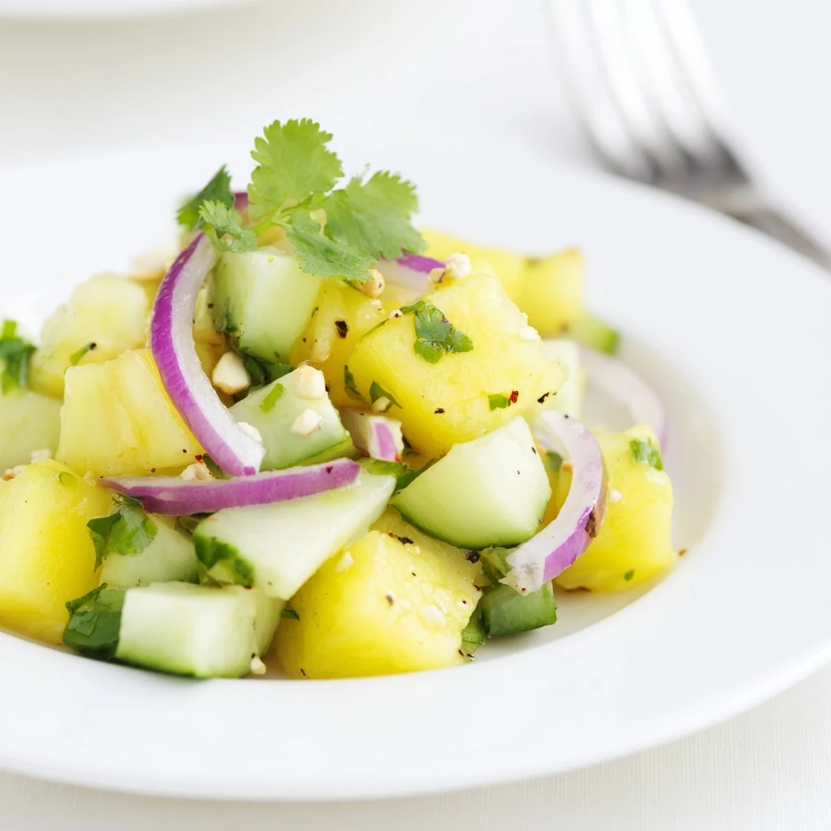 Vibrant Pineapple Cucumber Salad studded with red chili, crunchy, sweet, refreshing.