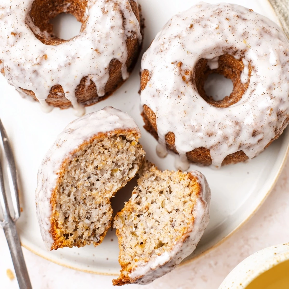 Banana Donuts cooling on wire rack, golden edges, sweet banana aroma