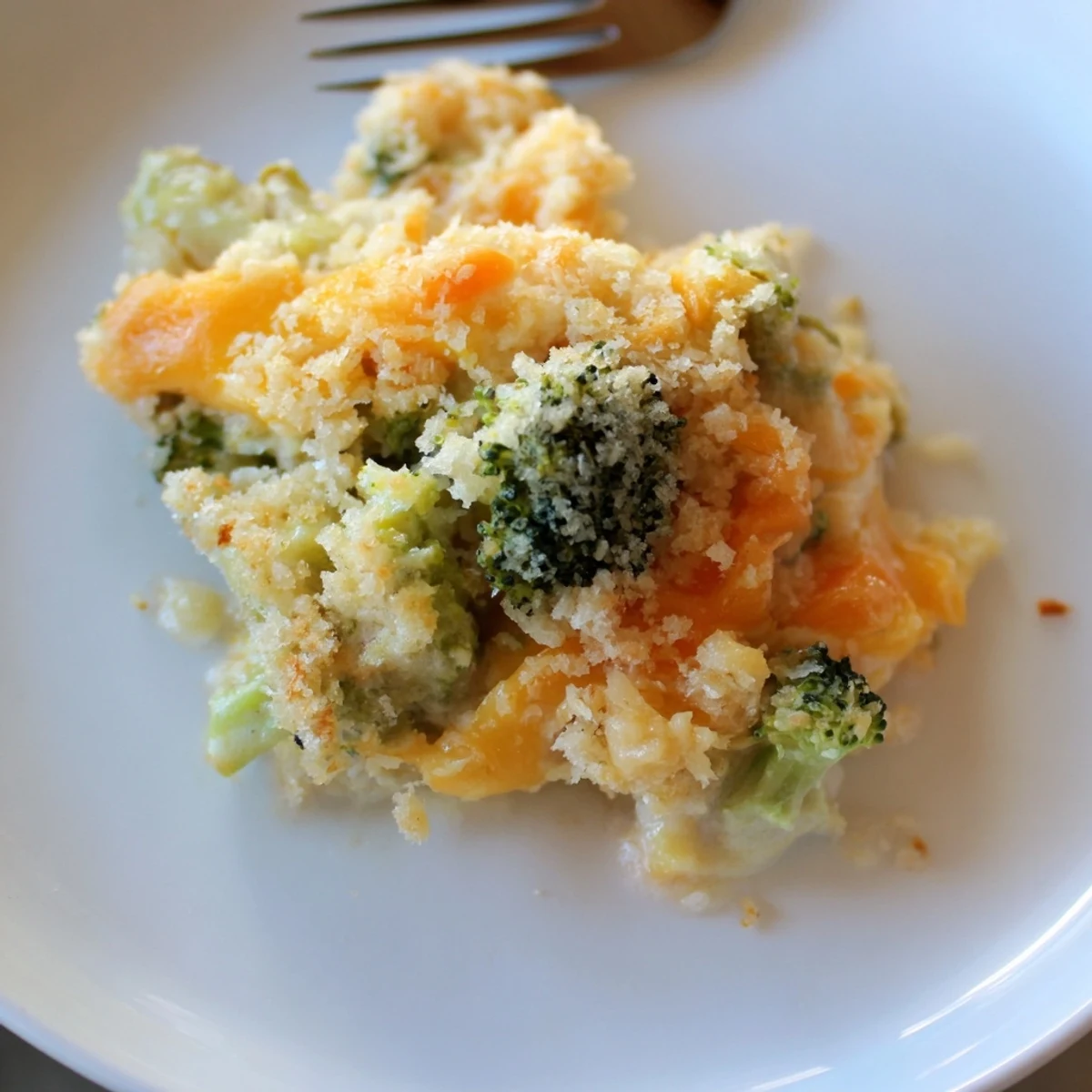 Cheese Bake Broccoli Carrots bubbling with golden crust, creamy cheddar and steam
