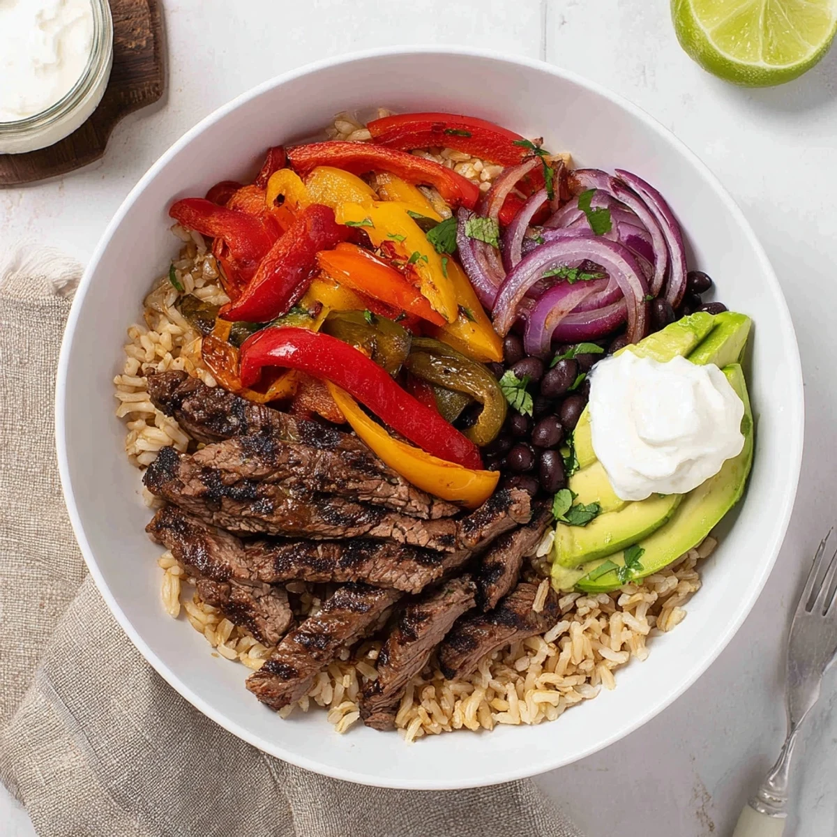 Colorful Steak Fajita Power Bowls: rice, black beans, warm spices, lime  