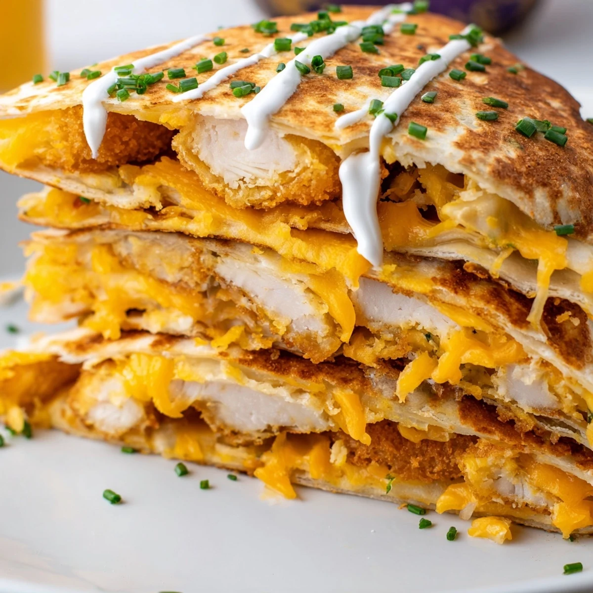 Golden quesadilla filled with crispy onion ring chips and melted cheddar mozzarella cheese