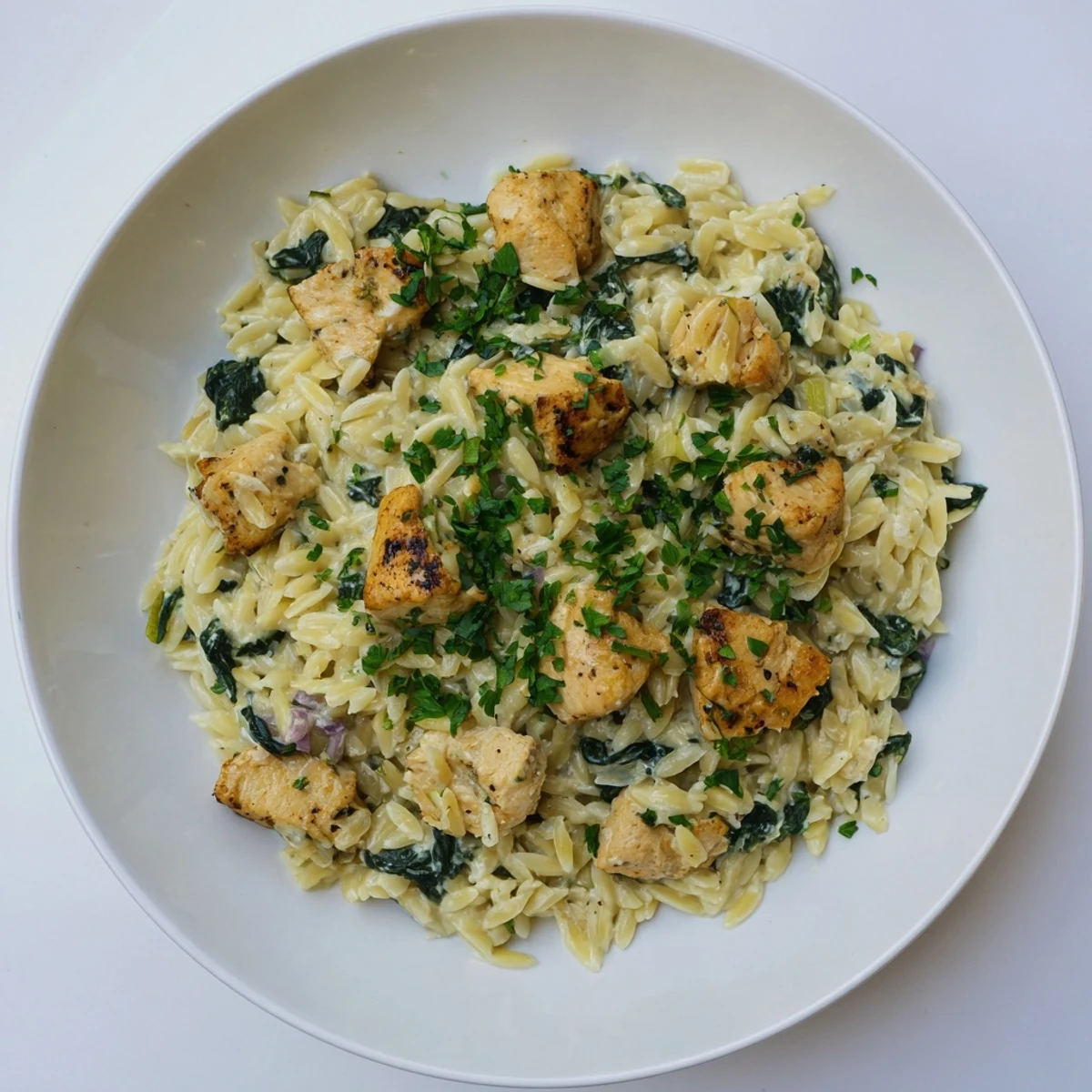One pan Boursin chicken orzo featuring tender pasta simmered in garlic herb cheese sauce.