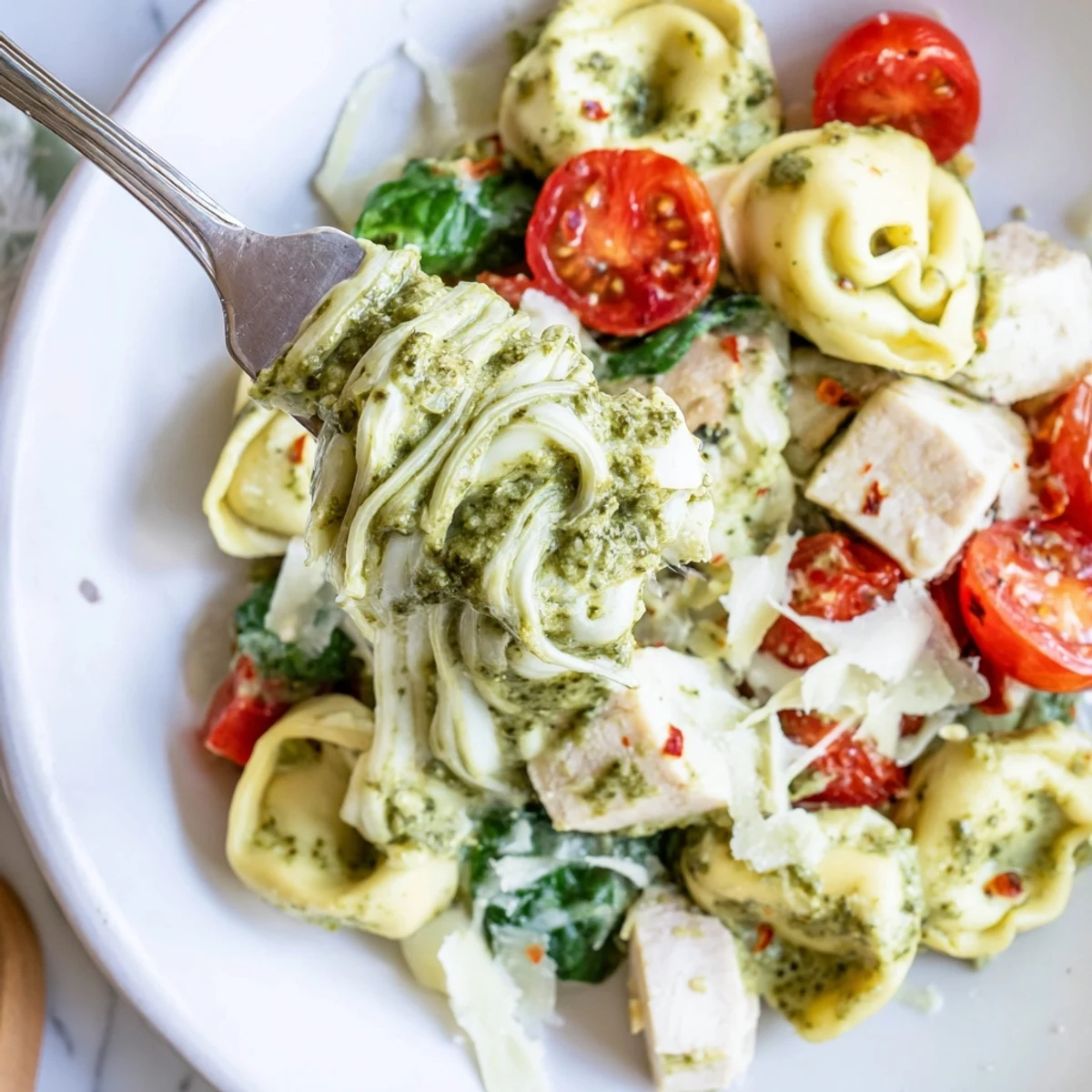 Slow Cooker Tortellini Casserole With Cheesy Chicken Pesto bubbling, served with crusty bread