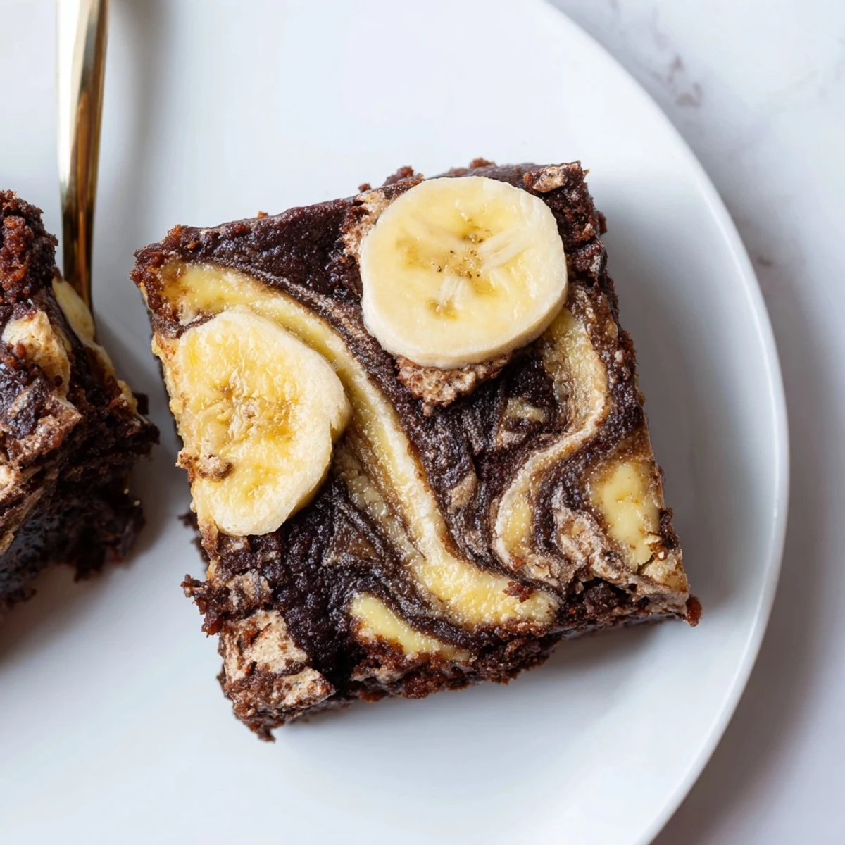 Banana Pudding Brownies with fudgy center, creamy banana swirls and crunchy wafers