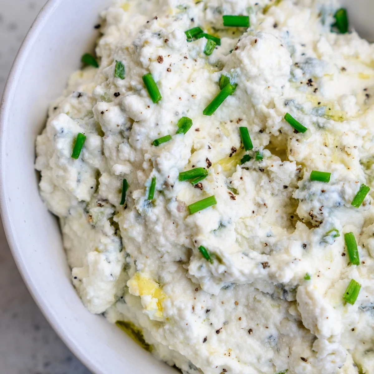 Thick blue cheese dip topped with fresh chives and crumbled blue cheese chunks