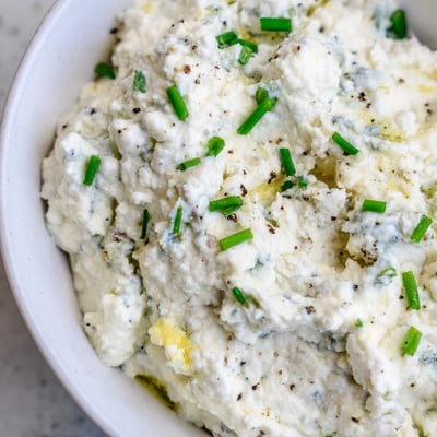 Thick blue cheese dip topped with fresh chives and crumbled blue cheese chunks